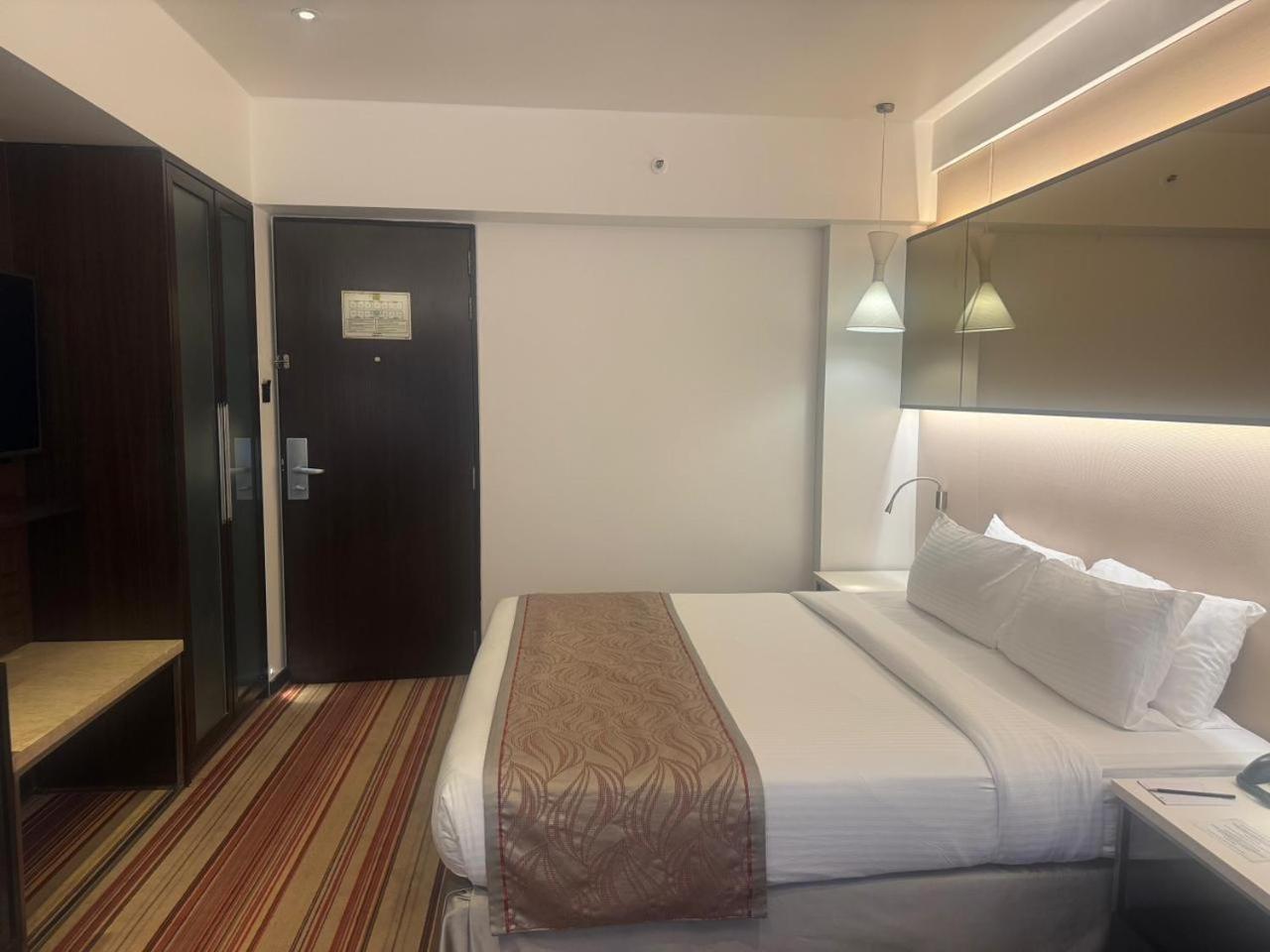 Superior Room King Bed on Laundry Food Soft Beverages